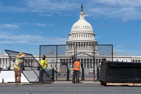 metal scaffolding around white house|Metal fencing surrounding Capitol in wake of the Jan..